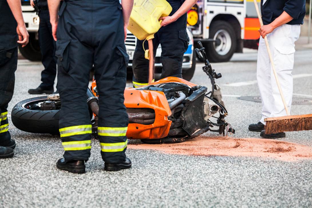A group of firefighters standing next to a motorcycle
AI-generated content may be incorrect.